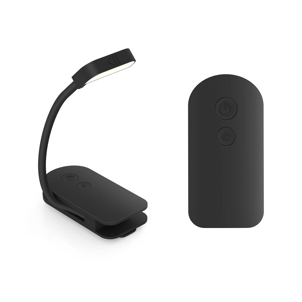 Black LED reading light and battery pack on a white background