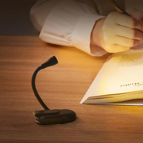 Portable clip-on reading light with flexible gooseneck neck on white background